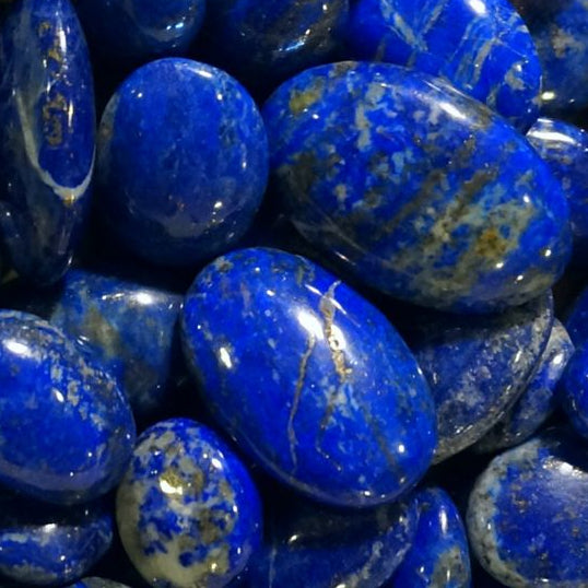 Close-up of lapis lazuli blue stones with white speckles